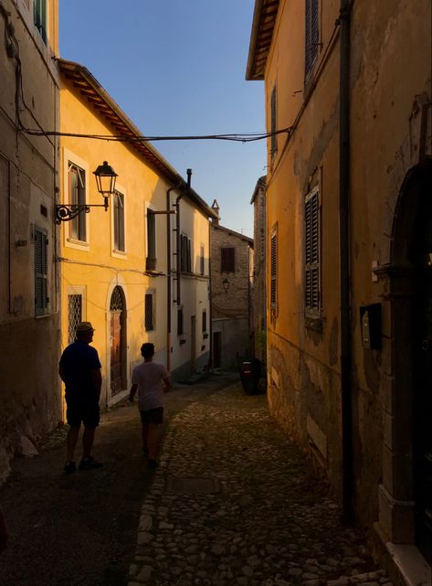 evening walks, italy, sunset, evenings in italy, small town, old town in italy, old street, streets in italy Italy Aesthetic House, Italian Town Aesthetic, Italian House Aesthetic, Small Italian Town, Small Italian Town Aesthetic, Small Town In Italy, Streets In Italy, Italian Neighborhood Aesthetic, Italy Town Aesthetic