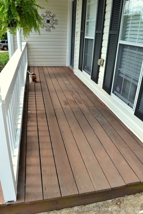 Front porch makeover (decorated for summer in red, white, and blue White And Wood Front Porch, Porch Stoop Makeover, Front Porch Wood Stains, Deck Stain For White House, White House Wood Porch, Refinish Wood Porch, Deck Stain Colors For White House, Tan House Front Porch, Farmhouse Porch Stain Colors