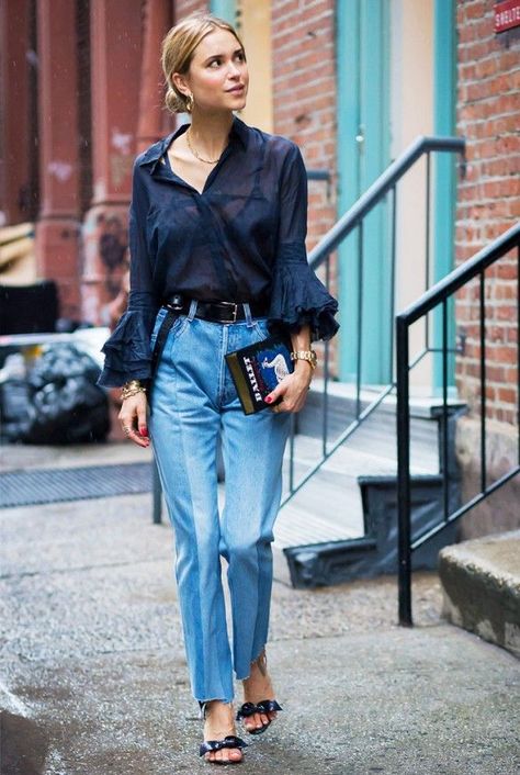 Pernille Teisbaek wears a sheer blue blouse with ruffle sleeves, paneled jeans, sandals with bow-detailing, and an Olympia le Tan book clutch | Style | The Lifestyle Edit Denim Hacks, Moda Do Momento, Jeans Trend, Looks Jeans, Street Style 2016, Walking Down The Street, Street Style Blog, Paris Mode, Stil Inspiration