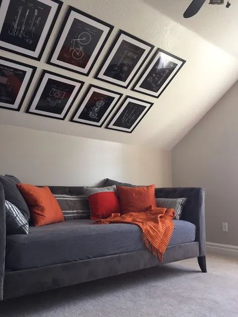 How to hang a gallery wall on a vaulted ceiling · The Glitzy Pear Gallery Wall Vaulted Ceiling, Hang Gallery Wall, Vaulted Ceiling Decor, Vaulted Ceiling Bedroom, Tan Sofa, Tan Leather Sofas, Slanted Walls, Tufted Bench, Hanging Artwork