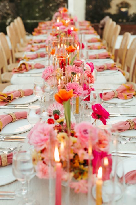 Taylor and Cale were set on wanting a tent for their reception, so they brought in a clear tent so guests could still enjoy the natural beauty of the venue. From there, Always Flawless Productions created a breathtaking statement piece of jute chandeliers and bougainvillea that ‘wowed’ guests as the made their way into the reception. This set the tone for the evening and perfectly paired with the whitewashed tables, natural wood chairs, and brightly colored florals. Pink And Orange Bud Vases Wedding, Pink Yellow Weddings, Bright Wedding Decorations, Pink Table Settings, Bright Pink Wedding, Orange And Pink Wedding, Darlington House, Pink Wedding Theme, Bright Wedding