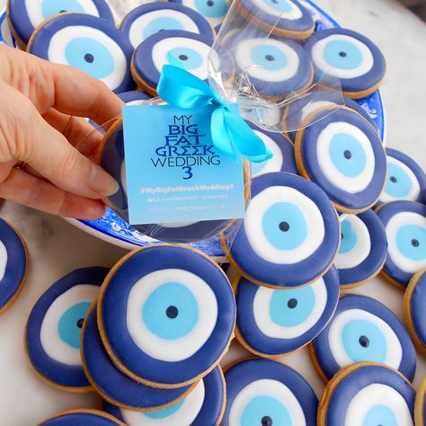 Evil Eye biscuits, custom made by Take The Biscuit UK for the premier of "My Big Fat Greek Wedding 3". London UK delivery only. Greek Party Decorations Ideas, Greek Themed Engagement Party, Greek Pool Party, Greek Hen Party, Greece Birthday Theme, Greek Engagement Party, Evil Eye Cookies, Greece Theme Party, Greece Birthday Party Ideas