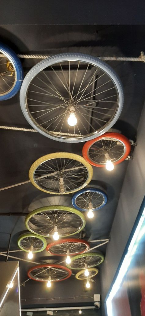 Bicycle Rim Projects, Bike Shop Interior Design, Cycle Store Design, Bike Wheel Art, Bicycle Room, Bicycle Wall Art, Tire Art, Bicycle Rims, Backyard Fireplace