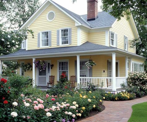 6+ Warm Yellow and Gray House Siding Ideas for a Cheerful Home • 333+ Inspiring Lifestyle Ideas Yellow House With Porch, Yellow Country House, Yellow And White House, Soft Yellow Exterior House Colors, Little Yellow House, Yellow Houses Exterior, Gray House Siding, Yellow House Shutter Colors, Garage On Side Of House