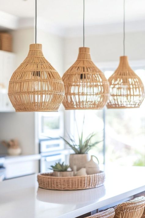 Opt for light bamboo pendant lights to add texture and warmth to your coastal home. These natural light fixtures provide a beachy, organic feel, especially when paired with soft pastel decor. Natural Wood Pendant Light, Boho Light Fixtures, Boho Light Fixture, Beach House Lighting, Pastel Decor, Wood Pendant Light, Bamboo Pendant Light, Modern Boho, Coastal Homes