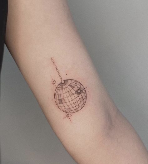 Taylor Swift Tattoo Ideas Small Mirrorball, Fineline Disco Ball Tattoo, Disco Ball With Flowers Tattoo, Mirrorball Fine Line Tattoo, Glitter Ball Tattoo, Disco Ball Heart Tattoo, Traditional Style Disco Ball Tattoo, Dainty Disco Ball Tattoo, Disco Globe Tattoo