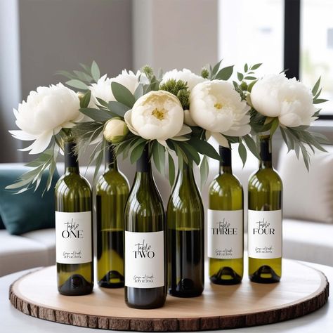 PRINTED Wine Table Numbers 1-10, Expandable Options Avail | Glossy Wedding Wine Table Numbers: Elevate Your Tablescape with Elegance and Practicality ---------------------- Description -------------------- Elevate the sophistication of your wedding tablescape with our glossy Wedding Wine Table Numbers. Crafted to perfection, these sleek table numbers adhere seamlessly to the bottles on your tables, adding an extra touch of elegance while serving as practical indicators for your guests. Each tabl May Wedding Table Centerpieces, Winery Table Setting, Wine Tasting Table Decor, Winery Centerpiece Ideas, May Wedding Decor, Wine Tablescape, Wine Dinner Decor, Wedding Wine Theme, Wine Bottle Centerpieces For Wedding