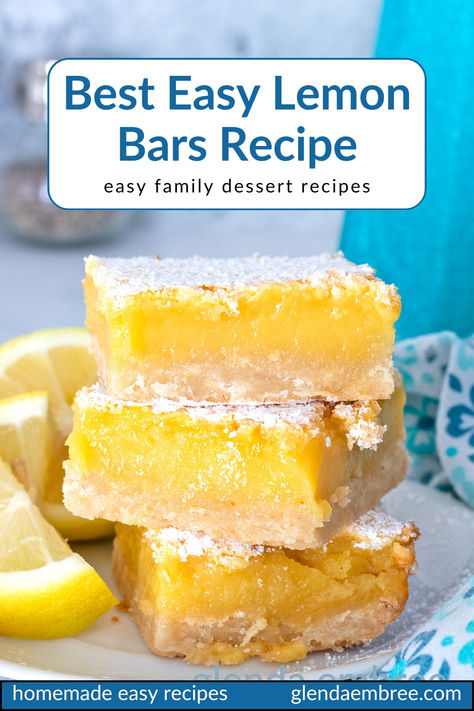 Three lemon bars stacked on a white ceramic plate with lemon wedges on the side. Quick And Easy Lemon Bars, Lemon Bars With Pretzel Crust, Sunny Anderson Lemon Bars, How To Make Lemon Bars, Super Easy Lemon Bars, Easy Pan Of Bars, Best Lemon Bar Recipe, Lemon Refrigerator Bites, Lemon Bars 8x8 Pan