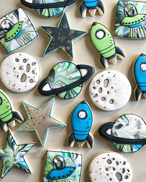 Space themed cookies! By @tinytudorcookies Galaxy Themed Cookies, Space Theme Cookies Decorated, Space Themed Decorated Cookies, Outer Space Cookies Decorated, Space Royal Icing Cookies, Space Decorated Cookies, Planets Cookies, Space Theme Treats, Spaceship Cookies