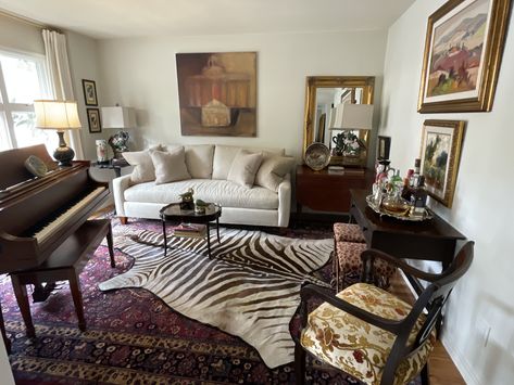 Layered over Persian rug Maximalist Rug Layering, Zebra Rug Living Room Ideas, Cheetah Rug Living Room, Layered Rugs Living Room, Summer Apartment, Layer Rugs, Feminine Apartment, Zebra Skin Rug, Rug Layering