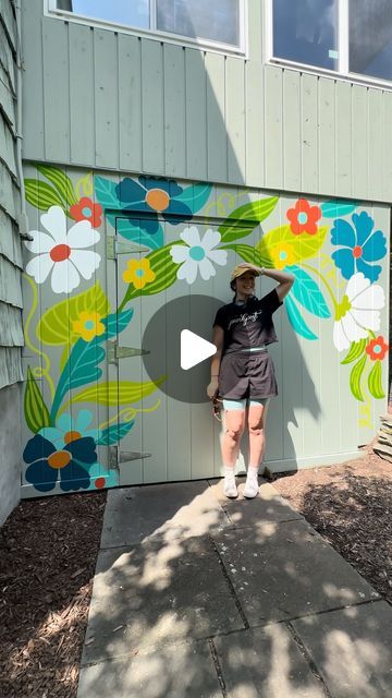 Jillian Goeler on Instagram: "Paint a mural with me!  I had the pleasure of painting some sweet florals on a residential shed this week 🥰 It was SWEATY but we persisted and the result is so cute!   This one’s a little different than my usual…no lettering and no stars!? ✨ who am I??" Wall Mural Design Ideas, Outdoor Floral Mural, Garden Murals Outdoor, Painted Shed Mural, Mural On Shed, Simple Flower Mural, Small Mural Ideas, Shed Murals Outdoor, Floral Mural Painting