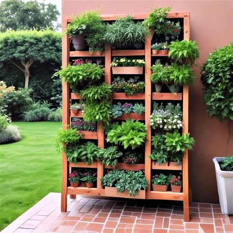 40 Vertical Garden Ideas for Indoor and Outdoor Spaces Living Garden Walls Outdoor, Outdoor Wall Herb Garden Ideas, How To Make A Living Wall Outdoors, Herb Garden Wall Outdoor, Herb Wall Outdoor, Vertical Garden Diy Outdoor, Vertical Garden Wall Outdoors, Garden Wall Ideas, Vertical Container Gardening