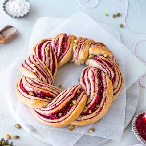 Raspberry and Pistachio Wreath Recipe - Rainbow Nourishments Raspberry And Pistachio, Wreath Recipe, Raspberry Pistachio, Bread Wreath, Jam Donut, Babka Recipe, Christmas Jam, Spiced Fruit, Vegan Cinnamon Rolls