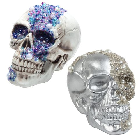 PRICES MAY VARY. Includes 2 Gem Studded Skulls (Measures 8" x 5.5") Comes with one silver skull decorated with pearl colored accents and one white skull covered with multi colored purple, blue, white, and cobalt gems. Crafted with attention to detail, these skulls feature realistic human head sculptures and are adorned with eye-catching rhinestones for an extra dose of creepiness- perfect for indoor or outdoor use! Turn your home into a haunted mansion or pirate's treasure trove - great for deco Bone Table, Fall Party Decor, Table Statue, Fun Fall Decor, Rhinestone Halloween, Yard Sculptures, Unique Centerpieces, Pirate Treasure, Human Head