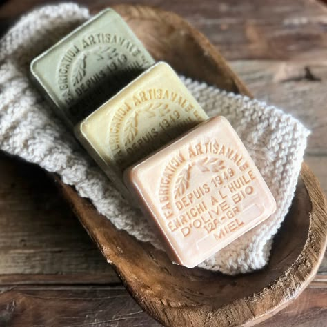 These authentic 100% natural and organic French Soaps are made from pure Marseille with Organic oil. This 3 piece set includes one lavender, one honey, and one clay soap. Each bar is stamped and are beautiful to fill jars, baskets, and dishes for your bath. The delicate scents fill the air with a fresh, clean aroma while soothing and softening your skin with nurturing oil. Made in France Each bar is approximately 4.2 oz. For White Enamel Soaps Bowl click here. For Wall Mounted Soap Dish click he French Soap Packaging, Soap Bars Aesthetic, Soap Dish Ideas, Bar Dish Soap, Custom Soap Molds, Spa Vibes, French Soap, Soap Packing, Marseille Soap