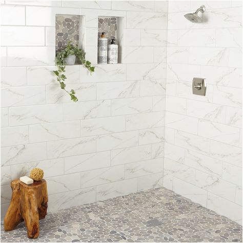 Create a spa experience in your own home. The Delfino stone collection by American Olean features a diverse selection of unique mosaic tile including this gorgeous gray pebble mosaic. Natural stone pebbles mounted onto a 12-in x 12-in sheet create an eye-catching finish to any space. American Olean Delfino Stone Bali Gray Blend 12-in x 12-in Unglazed Natural Stone Mixed Pebble Stone Look Floor and Wall Tile (1-sq. ft/ Piece) Stone Shower Floor, Master Shower Tile, Pebble Shower Floor, Rock Shower, Marble Shower Tile, Subway Tile Showers, Pebble Floor, Interlocking Deck Tiles, Fireplace Facade