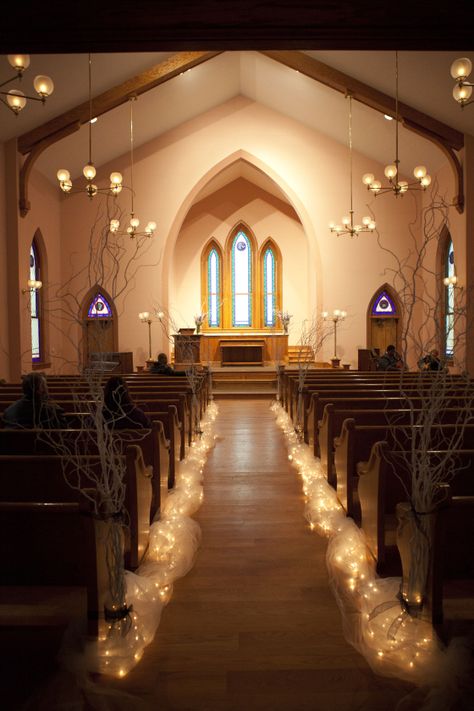 Ohio Village Church. Columbus Ohio Weddings. Willow Branches lined with lights make an elegant pathway. Wedding Aisle Lights Decor, Fairy Lights Aisle Wedding, Sanctuary Wedding Decorations, Tulle And Lights Wedding Decorations, Tulle Wedding Aisle, Wedding Aisle Lights, Elegant Aisle Decor, Christmas Aisle Decorations, Apostolic Wedding Ideas