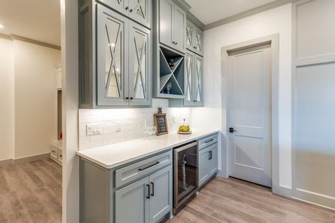 Butlers pantry with wet bar backsplash, cabinets, and wood flooring Wet Bar Backsplash Ideas, Pantry Glass Door, Bar Backsplash Ideas, Frosted Pantry Door, Pocket Door Pantry, Wet Bar Backsplash, Mud Room Laundry Room Combo, Frosted Glass Pantry Door, Bar Backsplash