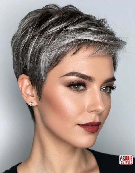 Textured Pixie Cut with Silver Accents | Balayage Transition To Gray Hair - Gray Hair Balayage In recent years, the beauty industry has witnessed a remarkable shift towards embracing natural beauty, and one prominent trend that reflects this movement is the transition to gray hair. Gray hair, once considered a sign of aging to be concealed, is now celebrated as a symbol of wisdom. Cute Short Gray Hairstyles, Silver Pixie Undercut Gray Hair, Short Grey Hair Highlights, Short Dark Hair With Silver Highlights, Grey Highlights Short Hair, Short Grey Pixie Haircut, Pixie Gray Hairstyles, Pixie Haircut Gray Hair, Pixie With Blonde Highlights