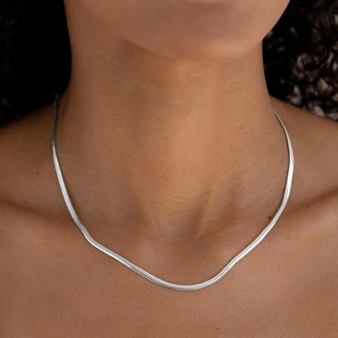 This stunning silver statement necklace boasts a sleek flat snake chain design that adds a touch of modern elegance to any outfit, whether worn alone or layered. The necklace is crafted in sterling silver. Snake chain has a width of 2.9mm Necklace has an adjustable length and can be set between 16” to 18” long Flat Silver Necklace, Silver Aesthetic Rings, Snake Chain Necklace Silver, Silver Necklaces Aesthetic, Outfit Bord, Farewell Dance, Silver Jewellery Aesthetic, Chain Necklace Outfit, Silver Jewelry Aesthetic