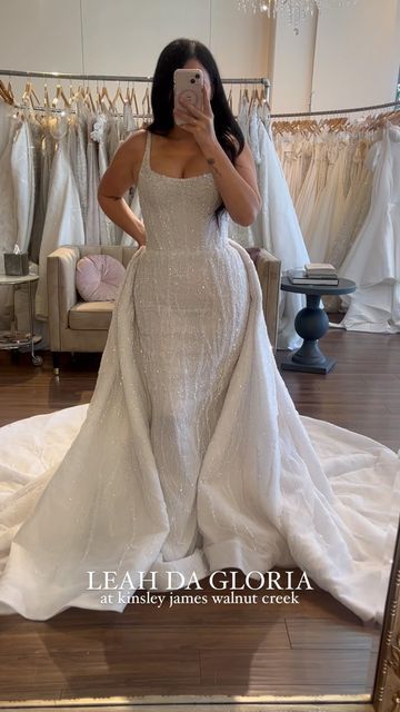 Kinsley James Couture Bridal on Instagram: "Obsessed is an understatement when it comes to this dress ✨ - - - - - - #weddinggown #bridetobe #losangeles #bridalboutique @theknot #bridaltrunkshow #herecomesthebride #soloverly #theknot #weddingchicks #theknotweddings #aisleperfect #wedding #sayyestothedress #bridalinspo #weddinginspiration #shesaidyes #bride #stylemepretty #californiabride #chicbride#californiawedding #romanticwedding #dressoftheday #bridegoals #walnutcreek #leahdagloria" Added Skirt Wedding Dress, Plus Size Convertible Wedding Dress, Wedding Dress With Overlay Skirt, Wedding Dress Attachable Skirt, Attachable Skirt Wedding Dress, Loose Mermaid Wedding Dress, Wedding Dress With Skirt Attachment, Wedding Dresses With Overskirt, Overlay Skirt Wedding Dress