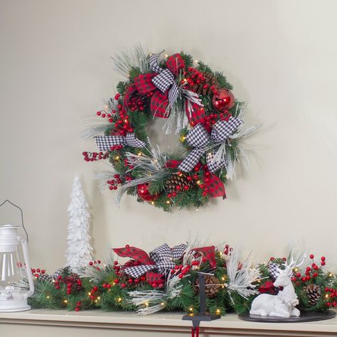 Decorative pre-lit plaid bows and berries Christmas wreath. Pre-lit with 30 warm white mini lights. No assembly required – wreath comes in 1 piece Christmas Wreaths With Lights, Christmas Stem, Buffalo Plaid Ribbon, Artificial Christmas Wreaths, Material Wreaths, Christmas Central, Christmas Swags, Indoor Christmas, Holiday Store