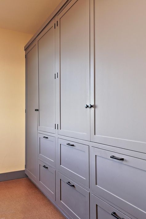 A wall of built-in cabinets provides plenty of room to store clothes and accessories in the bedroom. Bedroom Wall Cabinets, Floor To Ceiling Cabinets, Bedroom Built Ins, Wall Storage Cabinets, Bedroom Storage Cabinets, Room Storage Diy, Ceiling Storage, Basement Storage, Bedroom Cabinets