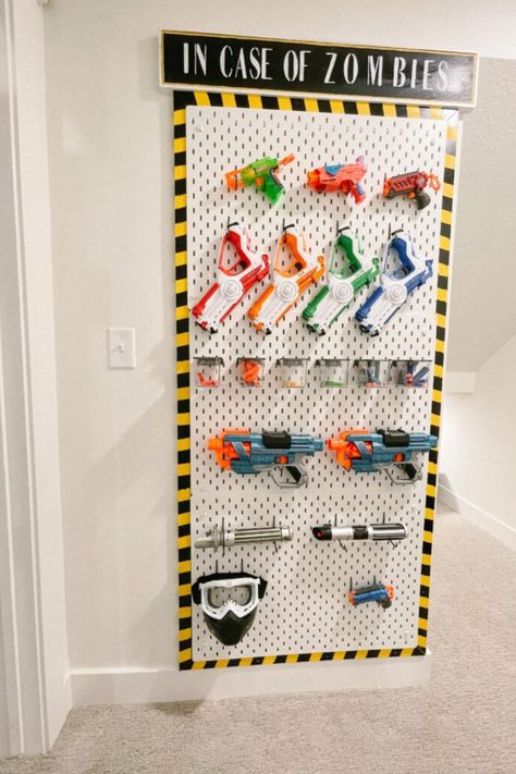 Are you looking for a fun and easy way to store and organize your son's Nerf guns? Our DIY Nerf Gun Wall is the perfect solution! Learn how to build a unique wall using easy-to-follow step-by-step instructions to create the ultimate boys room storage. Here you'll also find ideas to help organize Nerf guns and accessories. Please visit us for more boys room, storage, and organization ideas. Nerf Organization Ideas, Boys Room Storage, Nerf Storage, Boys Room Diy, Storage And Organization Ideas, Peg Wall, Boys Playroom, Playroom Organization, Shower Surround