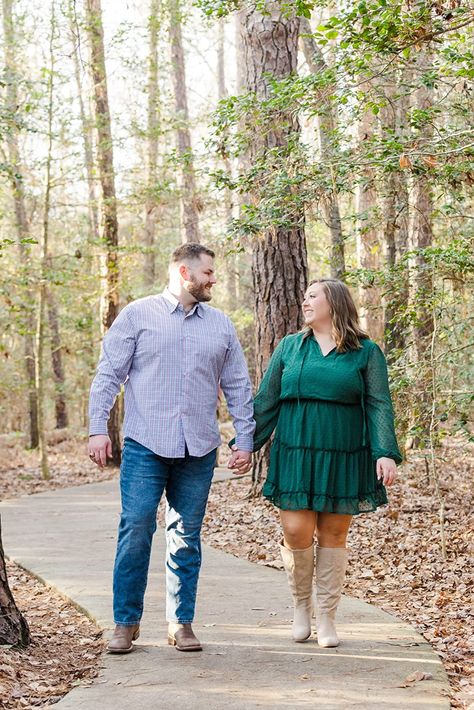 Couple taking engagement photos in the fall. Woman is curvy and wearing knee high boots and a green dress Engagement Photo Ideas Plus Size, Engagement Picture Outfits Plus Size, Couple Poses Reference Plus Size, Engagement Shoot Plus Size, Engagement Photo Plus Size, Fall Engagement Photos Plus Size, Spring Engagement Photos Outfits Plus Size, Plus Size Poses For Pictures Couples, Engagement Photos Plus Size Couple