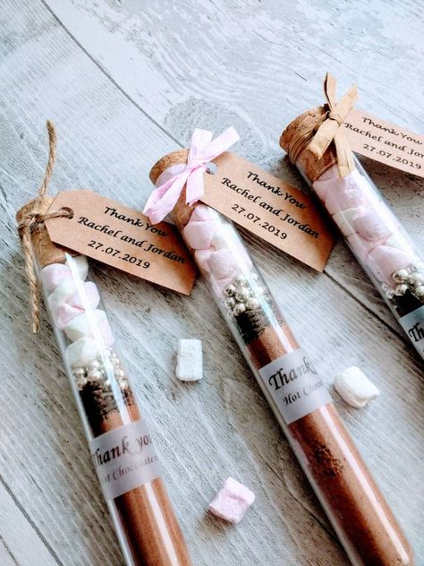 Wedding favor ideas for winter weddings. Say thank you to your winter wedding guests with homemade hot chocolate wedding favors from The Pure Moment! This prefill hot chocolate mix in tube is a really nice and tasty small thank you gift. It comes with couple names, wedding date and Hot Chocolate Wedding Favors, Hot Cocoa Gift, Small Thank You Gift, Cocoa Gift, Creative Wedding Favors, Inexpensive Wedding Favors, Winter Wedding Favors, Bridal Shower Party Favors, Chocolate Wedding Favors