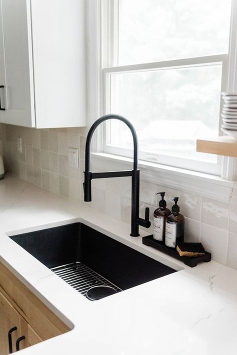 Add a bold statement in your kitchen with a black quartz sink and matte black faucet.

Photo/design: @giulianodesigns

#kitchenremodel #kitchendesign #homedecor #homedesign #homeremodel Black Kitchen Sink With White Countertop, Deep Black Kitchen Sink, Black Farmhouse Sink With Gray Cabinets, Black Sink Kitchen White Counter, Black Home Fixtures, Black Kitchen Sink With Black Faucet, Black Tap Kitchen Sinks, Black Kitchen Faucet Gold Hardware, Large Black Kitchen Sink