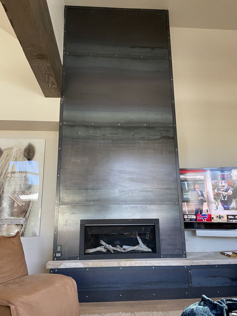 Metal wrapped fireplace wall Steel Fireplace Wall, Metal Wrapped Fireplace, Steel Wrapped Fireplace, Iron Fireplace, Steel Clad Fireplace, Steel Fireplace, Steel Fireplace Surround, Black Steel Fireplace Surround, Fireplace Ideas Modern Contemporary