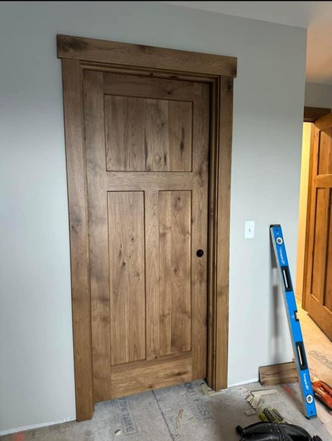 Mission Doors Interior, Wood Trim Interior Modern, Stained Trim Interior Farmhouse, Wood Doors With Wood Trim, White Molding Wood Doors, Stain Grade Trim, Wood Doors With Wood Floors, Different Trim Colors In House, Wood Trim Farmhouse Style