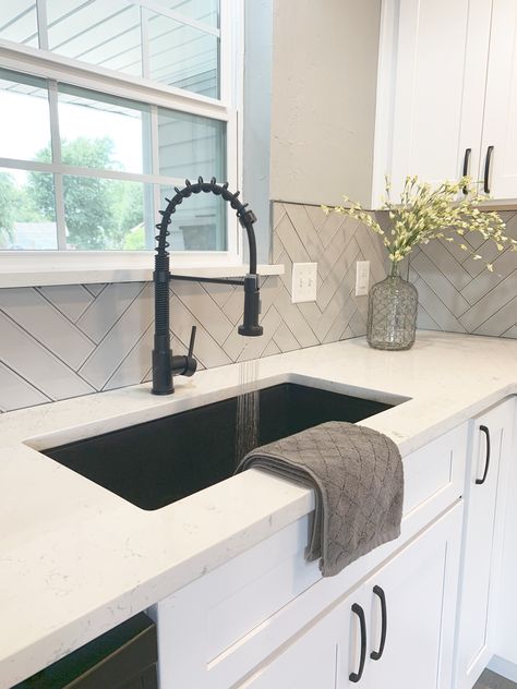 Black Sink And Black Faucet, Black Farmers Sink, Black Home Hardware, White Kitchen With Black Farmhouse Sink, White Sink Black Countertops, Farmhouse Kitchen Black Sink, Kitchen Matte Black Hardware, White And Black House Interior Design Kitchen, Farmhouse Sink With Quartz Countertops