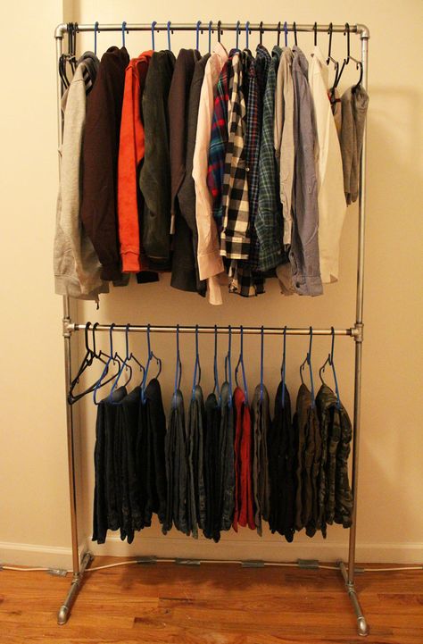 No closet? No problem! Check out how I built a wardrobe rack for my son's clothing using plumbing pipe. Yes that's right, plumbing pipe. This project is so easy that my little man could have practically built it himself and it looks totally rugged and cool! Read on for a step by step tutorial with pictures to help you build your own Pipe Clothes Rack, Apartment Wishlist, Family Closet, Diy Clothes Rack, Pipe Rack, Hanging Clothes Racks, Clothes Hanging, Galvanized Pipe, Diy Pipe