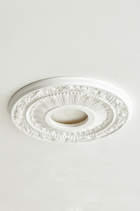 This sturdy high-density medallion is made of the highest quality material, available for a fraction of the cost of traditional plaster or wood. Easy installation using common woodworking tools and adhesive provides a dramatic change with instant elegance and personality. Add luxury and attractiveness to an average ceiling fan, uninspiring light fixture, or get creative by mounting them on the wall with an open frame for a knockout art piece. Ceiling Medallion Ideas, Ceiling Medallion Wall Art, Modern Ceiling Medallions, Chandelier Medallion, Victorian Beach House, Painted Beams, Ceiling Domes, Decorative Ceiling Tile, Plaster Ceiling