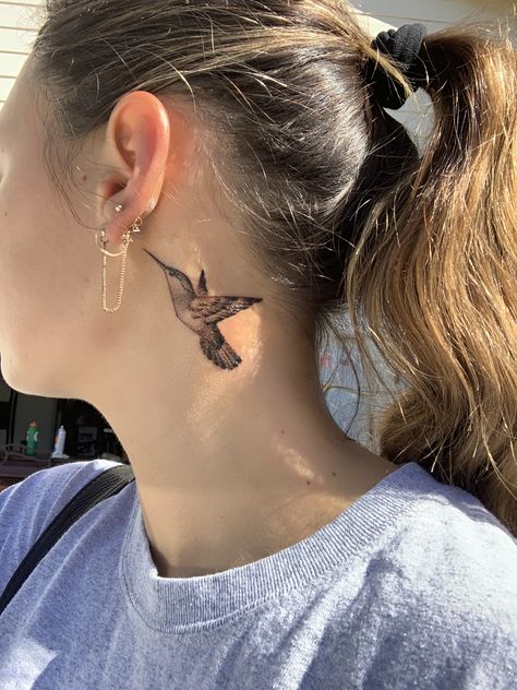 Beautiful, meaningful hummingbird tattoo behind the ear  Done at Stay True Tattoo in Dublin, CA. Behind The Ear Tattoo Ideas Hummingbird, Hummingbird Tattoo Neck, Hummingbird Tattoo Ear, Bird Ear Tattoo, Hummingbird Ear Tattoo, Behind The Ear Hummingbird Tattoo, Small Hummingbird Tattoo Behind Ear, Humming Bird Neck Tattoo, Humming Bird Tattoo Behind Ear