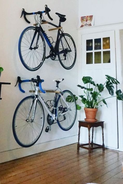 Maximize your small space with this sleek vertical bike storage solution! Perfect for keeping your bikes organized and off the floor. Dive into the post for more smart vertical storage tips! Bike Storage In Apartment, Home Bike Storage, Apartment Bike Storage, Small Apartment Bike Storage, Storing Bikes In Apartment, Store Bike In Small Apartment, Minimalist Bike, Bike Storage Apartment, Indoor Bike Storage