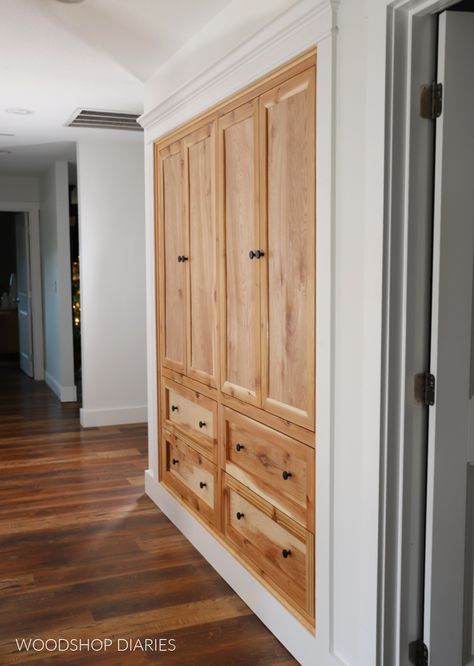 Learn how to turn a basic closet into custom built ins with this tutorial. Make your storage functional with hallway closet built ins. Hall Built In Storage, Custom Built Closets Master Bedrooms, Hallway With Closets, Closet Around Door, Built In Cabinet Closet, Turn Closet Into Built In Pantry, Hallway Closet Ideas Storage, Hallway Laundry Closet Storage, Custom Wall Closet Built Ins