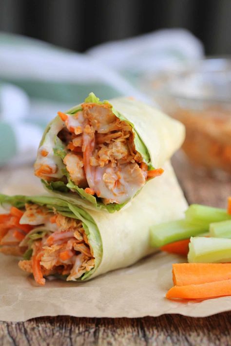 These BUFFALO CHICKEN WRAPS are made with tangy buffalo chicken, lettuce, carrots, cheese, and creamy dressing. It's a quick tasty 5 minute lunch idea. Chicken Buffalo Wrap, Buffalo Chicken Celery Sticks, Tortilla Sandwiches, 5 Minute Lunch, Cranberry Fluff Salad, Buffalo Chicken Wrap Recipe, Buffalo Wrap, Buffalo Chicken Celery, Buffalo Chicken Wrap