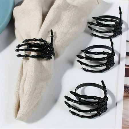 Halloween Party Creative Napkin Storage Ring Napkin Decoration Ring Features: With creative skeleton hand shape design, the napkin ring is perfect for Halloween, Christmas and Thanksgiving party table decoration. What the napkin ring can offer you is that is enough to meet the Halloween decor needs of your warm family or cafeteria. Made of alloy material, it is long lasting. The length of the napkin ring is 5.5cm and the width is 5cm. It is suitable to use in festival, dinner party or banquet. Product Description: Halloween Party Creative Napkin Storage Ring Napkin Decoration Ring Material: Stainless steel Color: as the picture shows, (Due to the difference between different monitors, the picture may have slight color difference. please make sure you do not mind before ordering, Thank you! Halloween Wedding Place Cards, Halloween Wedding Table Settings, Gothic Decorations Party, Halloween Place Settings, Elegant Halloween Tablescape, Gothic Wedding Centerpieces, Goth Wedding Decorations, Halloween Decor Classy, Halloween Dinner Table Decor