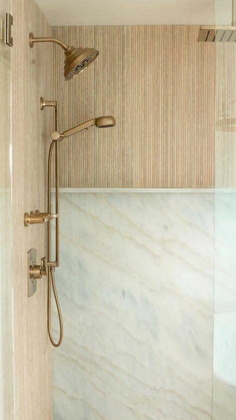 Tile Collective | Elevate your primary shower with this ribbed, wood-look porcelain tile to create an element of texture and warmth to your space… | Instagram Bathroom With Tile Baseboard, Stacked Shower Tile Ideas, Bathroom Shower Wood Tile, Tile Bar Bathroom Ideas, Primary Shower Tile, Wood Look Tile In Bathroom, Wood Ribbon Tile Bathroom, Solid Slab Shower Walls, Fluted Bathroom Tiles