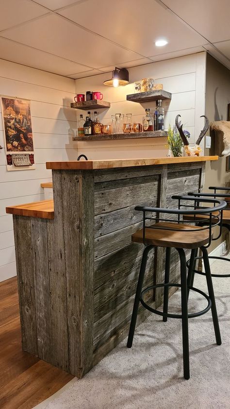 Rustic barnwood wet bar, shiplap walls, butcher block countertop, barnwood floating shelves Country Home Bar Ideas, Basement Wrap Around Bar Ideas, Man Cave Garage Wall Shelves, Reclaimed Wood Bar Ideas, Rustic Bar Basement, Kitchen Island Rustic Farmhouse, Cheap Basement Bar Ideas, Wet Bar Counter, Butcher Block Countertops Bar