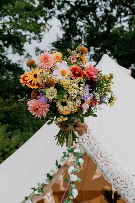 A bright joyful wedding bouquet full of colourful seasonal British grown September flowers. Perfect for a relaxed festival style wedding! Designed and created by @bryonymaeflowers Photography by @LaurenBethPhotography Please click on photo to see more. #festivalwedding #brightweddingbouquet #britishflowers #colourfulwedding #sussexflorist Wildflower Style Wedding Bouquet, Wild Flower Backyard Wedding, September Flowers Bouquet, Multicolour Wedding Flowers, Fresh Wildflower Bouquet, Wedding Colourful Flowers, Colourful Fall Wedding, Bright Wedding Flowers Bouquet, Colourful Wedding Flowers Bouquets