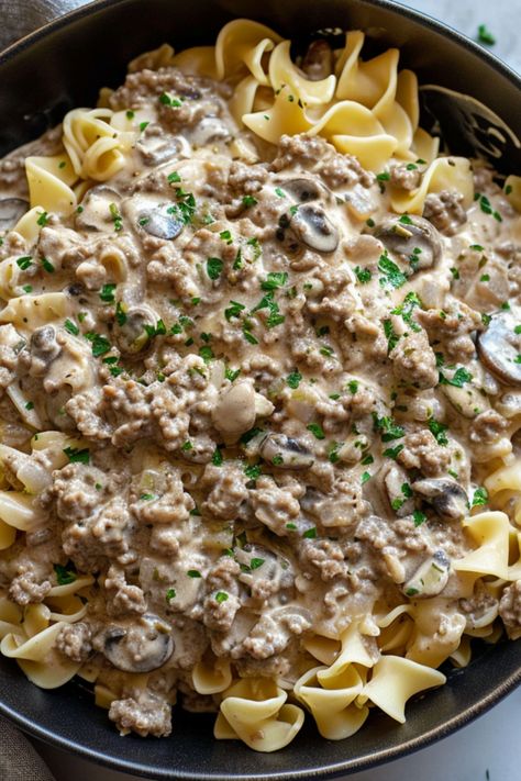 Ground Beef Stroganoff recipe, an easy, creamy dinner option. This homemade favorite, with mushrooms and cream of mushroom, is ideal for keto diets. Cook in a crockpot, instant pot, or any cookware for a simple, healthy entrée. Enjoy this scratch-made Ground Beef Stroganoff recipe at simplycalledfood.com and check other dishes with ground beef. Swedish Ground Beef Recipes, Ground Beef Stroganoff Recipe Easy Cream Of Mushroom, Gr Beef Stroganoff, Simple College Meals Easy Dinners, Ground Beef With Cream Cheese, Ground Beef With Mushrooms, Beef Stroganoff With Ground Beef Easy, Hamburger Meat And Mushrooms Recipes, Ground Beef Stroganoff With Cream Cheese