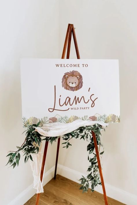 Welcome your little adventurer's guests with our Boho Jungle Safari Lion Birthday Welcome Sign. With the editable features, you can personalize and download instantly, adding that special touch to your wild one's birthday party. The design features a playful lion, leafy greenery, and bohemian elements, perfect for a wild and fun-filled celebration. This digital printable is easy to print, enhancing any jungle, safari, or wild one themed party decor with bohemian charm. Safari Birthday Party One Year, Wildone 1st Birthday Party, Lion 1st Birthday Party Ideas, First Birthday Backdrop Ideas, Lion Birthday Party Ideas, Wild One Party Ideas, Lion Themed Birthday Party, Wild One Birthday Party Boys, Lion Birthday Theme