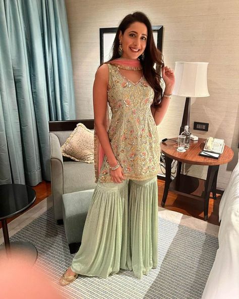 Pragya Jaiswal in sage green gharara set by Bhumika Grover for Diwali Green Indian Outfit, Green Gharara, Fizzy Goblet, Green Sharara, Gharara Designs, Pragya Jaiswal, Diwali Outfits, Frock Patterns, Simple Kurti Designs