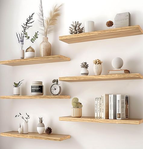 PRICES MAY VARY. Real Wood Floating Shelves: Crafted from solid wood for a durable and sturdy design. PHPH wood floating shelves with natural wood grain give a rustic feel to any space. Modern Rustic floating shelves: PHPH modern rustic floating shelves provide a industrial look that will blend well with modern and farmhouse wall decor alike. You are sure to make a welcome addition and a warm touch to your bathroom, kitchen, bedroom, or living room. Display Decor Floating Shelves: The rustic flo 6 Inch Floating Shelves, Floating Shelves Set, Gold Floating Shelves Kitchen, Boho Wall Shelves Bedroom, Shelves On Wall Ideas, Shelving For Bedroom Wall, Modern Bedroom Shelving, Multiple Floating Shelves On Wall, Natural Wood Wall Shelves