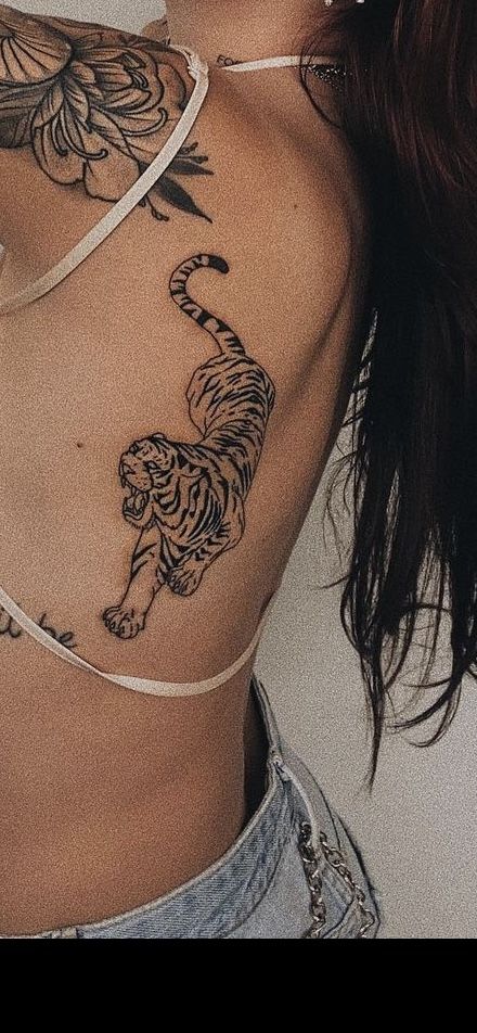 Tiger Tattoo On Knee, Tiger On Back Tattoo For Women, Tiger Tattoo Shoulder For Women, Tiger Tattoo On Rib Cage, Women’s Tiger Tattoo, Tiger Tattoo Forearm Women, Dainty Tiger Tattoo For Women, Tigress Tattoo For Women, Lioness Roaring Tattoo