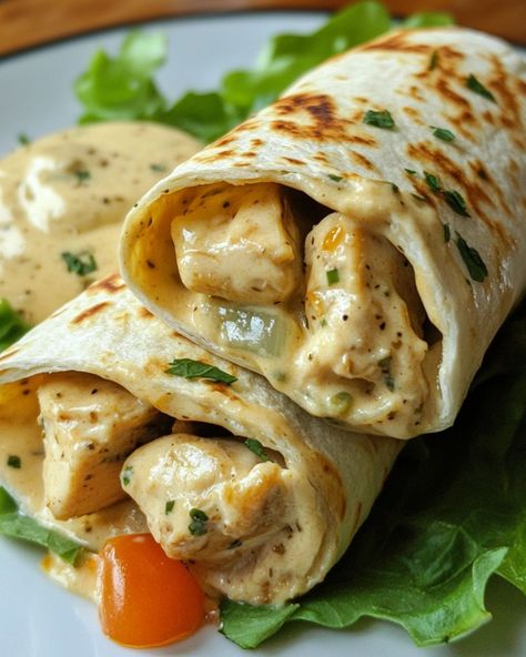 Chicken Alfredo Wraps 🌯 Ingredients: - 2 cups cooked chicken, shredded - 1 cup Alfredo sauce - 1/2 cup shredded mozzarella cheese - 4 large tortillas - 1/4 cup grated Parmesan cheese - Fresh parsley (optional) Directions: - Warm the tortillas slightly to make them flexible. - In a bowl, mix the cooked chicken with Alfredo sauce and mozzarella cheese. - Spoon the chicken mixture onto each tortilla and sprinkle Parmesan cheese on top. - Roll up the tortillas tightly to form wraps. - Grill or ... Chicken Alfredo Wraps, Food To Make With Tortillas, Chicken With Alfredo Sauce, Tortilla Ideas, Stuff Chicken, Chicken Shredded, Chicken Roll Ups, Chicken Roll, Plats Healthy